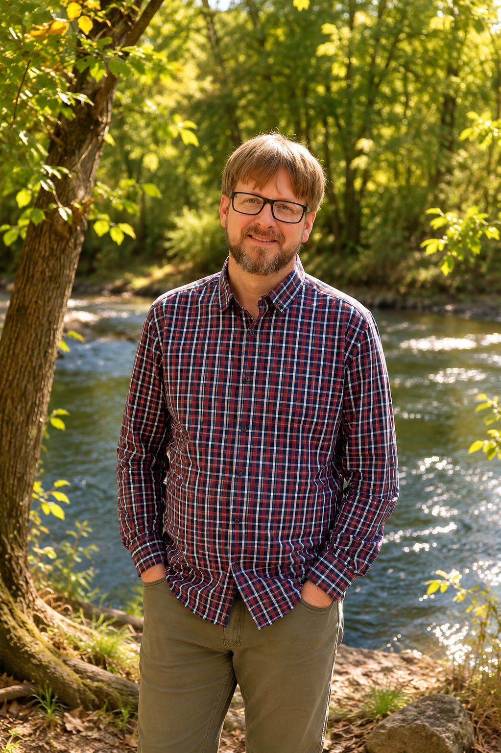 Jack, owner and home inspector at Stonecreek Inspections, standing outdoors near a creek